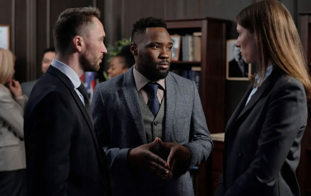 People in suits having a serious conversation
