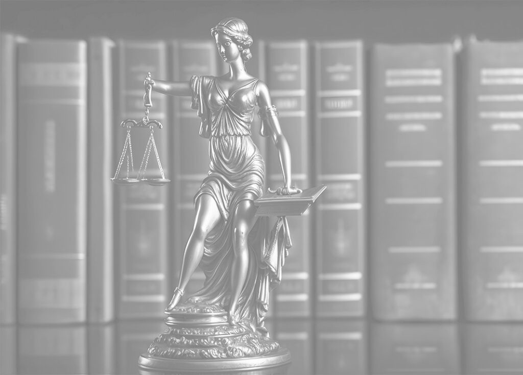 goddess of justice statue in black and white