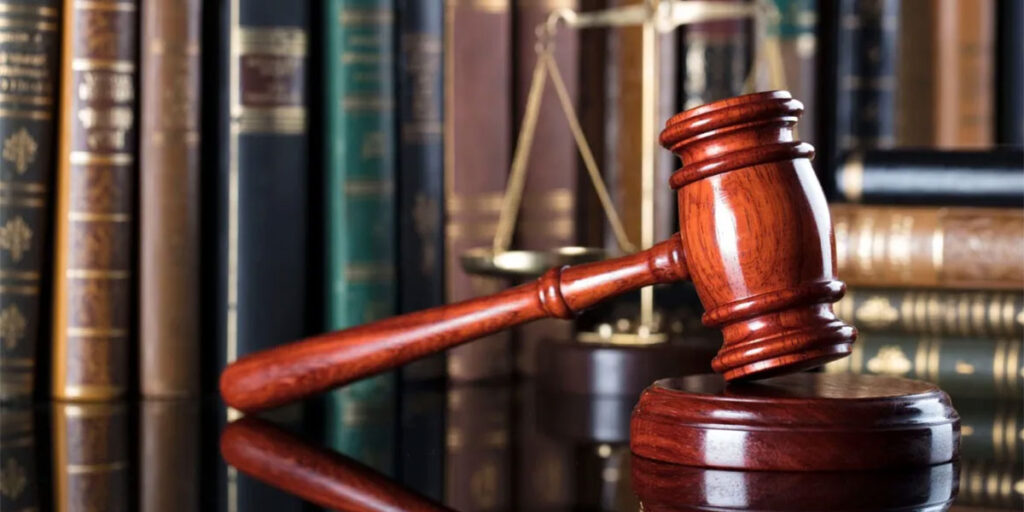 Gavel in front of law books