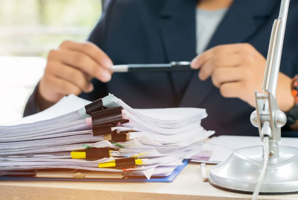 Lawyer at a desk with a stack of papers